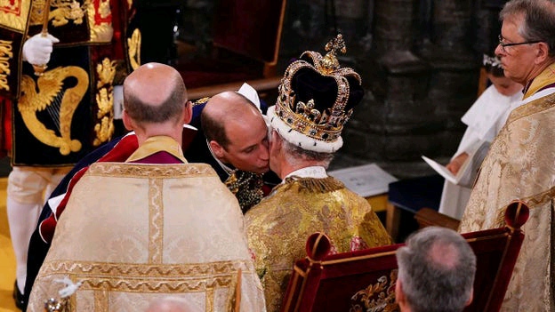 Prince William honors his father, King Charles III, during coronation ceremony at Westminster Abbey